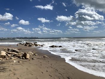 Scenic view of beach against sky