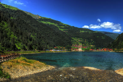 Scenic view of mountains against clear blue sky