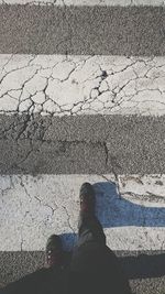 Low section of man on zebra crossing