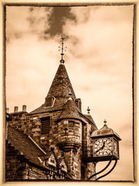 Low angle view of church against cloudy sky