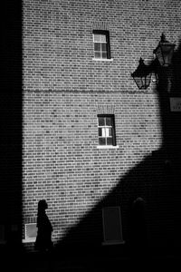 Shadow of man walking on wall