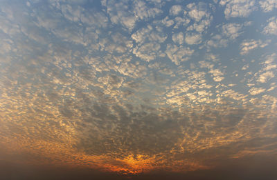 Low angle view of dramatic sky during sunset