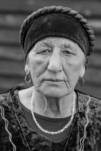 Russia close-up black-white portrait of a village elderly woman in a tatar dress