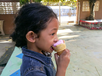 Close-up of cute girl eating ice cream