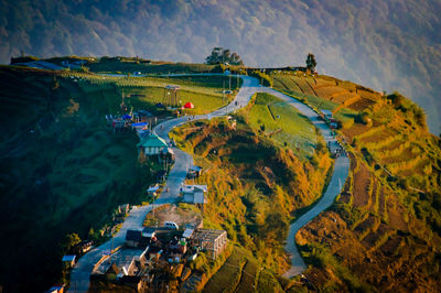 High angle view of people on mountain against sky