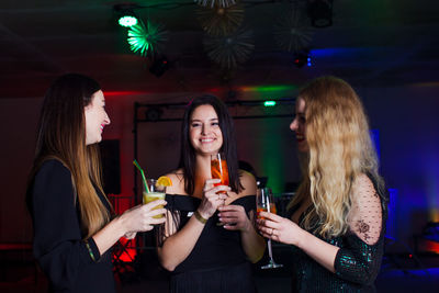 Friends toasting wineglasses at restaurant