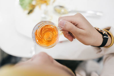 Midsection of woman holding a cup of tea