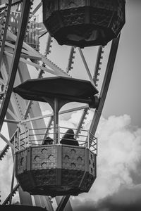 Low angle view of ferris wheel against sky