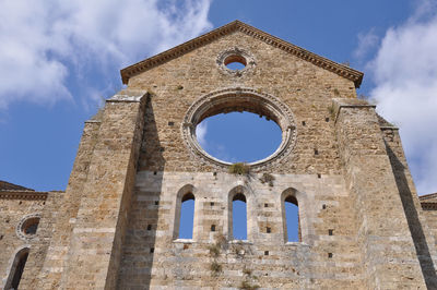 Low angle view of historic church against sky