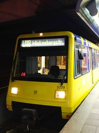 Yellow train at night