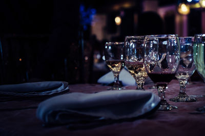 Close-up of drink on table in darkroom