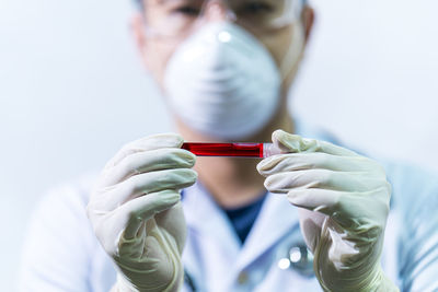 Midsection of man wearing mask