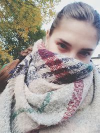 Close-up portrait of young woman in winter