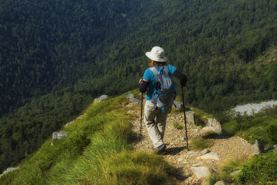 Full length of woman walking on mountain