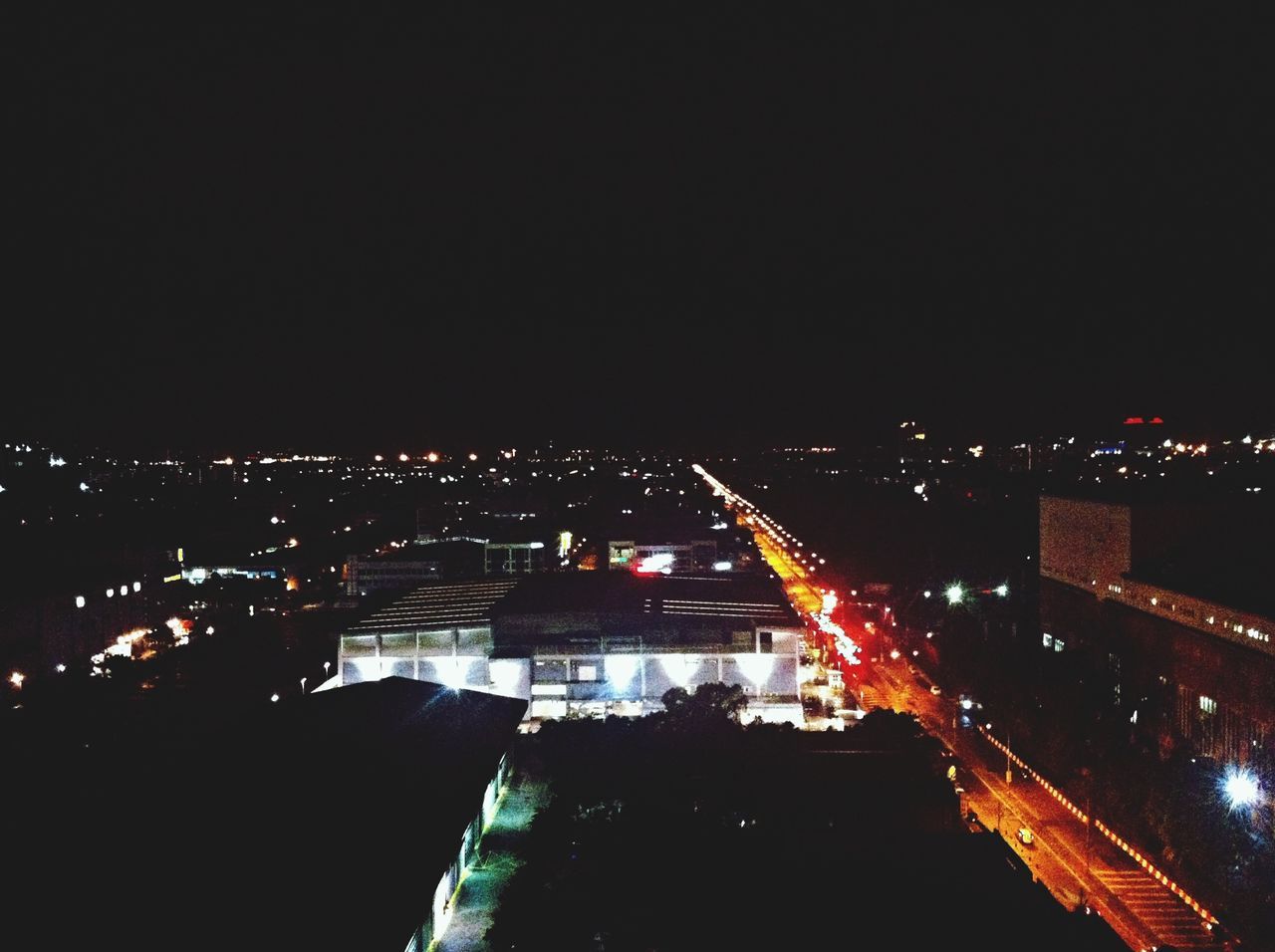 night, illuminated, building exterior, architecture, built structure, city, cityscape, high angle view, copy space, residential building, clear sky, city life, residential district, residential structure, crowded, sky, dark, outdoors, no people, road