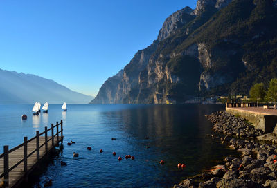 Scenic view of sea against clear blue sky