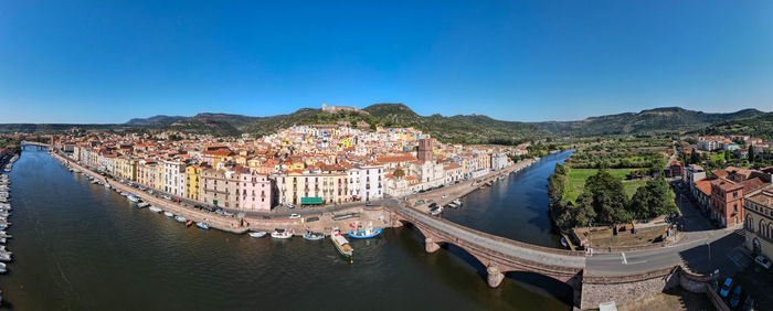 High angle view of cityscape against clear blue sky