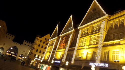 Low angle view of illuminated city at night