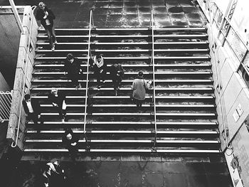 High angle view of people walking on escalator