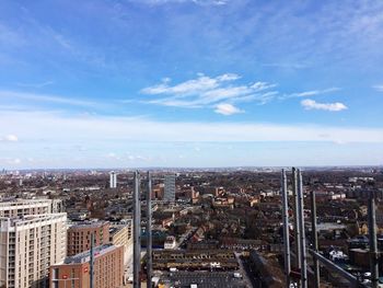 High angle view of buildings against blue sky