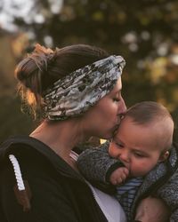 Portrait of mother and daughter outdoors