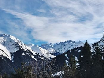 Scenic view of snowcapped mountains against sky