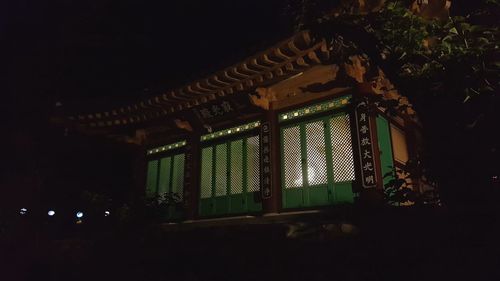 Low angle view of illuminated building at night