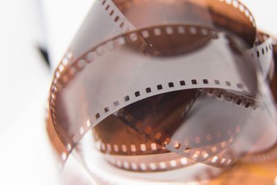 Close-up of film reel against gray background