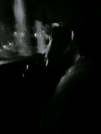 Close-up of man in dark room