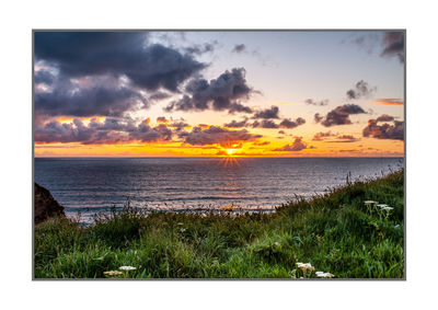 Scenic view of sea against sky during sunset