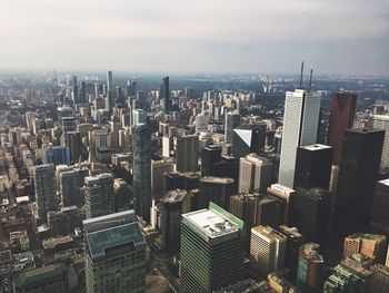 High angle view of modern buildings in city against sky