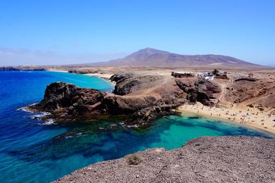 Scenic view of sea against blue sky