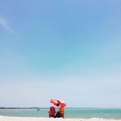 Rear view of man standing on beach