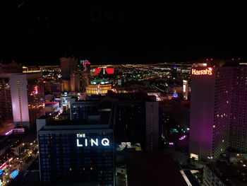 High angle view of illuminated buildings in city at night