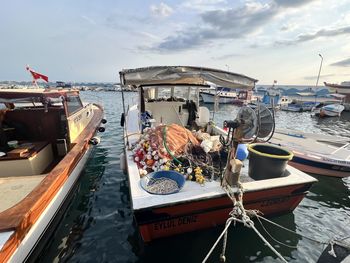 Boats moored at harbor