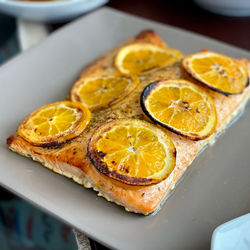 Delicious orange infused and marinated salmon seassoned with fine herbs olive oil plus salt n pepr