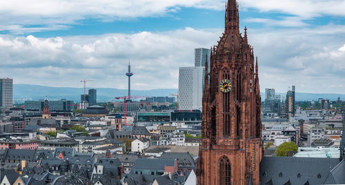Buildings in city against sky
