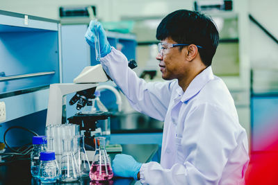 Scientist analyzing medical sample in laboratory