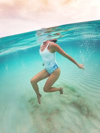Woman swimming in sea