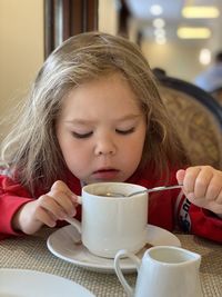 Portrait of girl drinking coffee