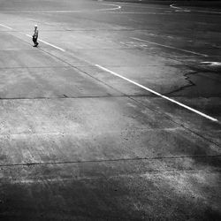 High angle view of man walking on road