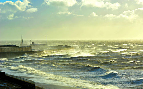 Scenic view of stormy sea against sky