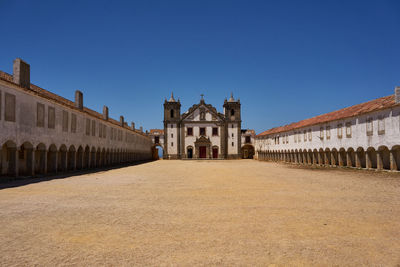 View of historic building against clear blue sky
