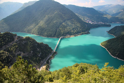 High angle view of lake amidst mountains
