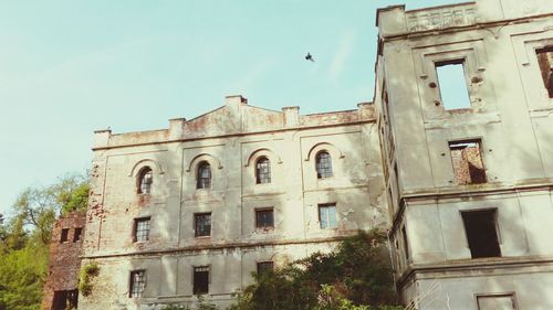 Low angle view of old building against sky