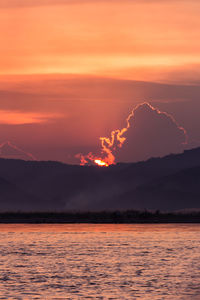 Scenic view of sea against romantic sky at sunset