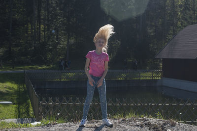 Full length of girl standing at park