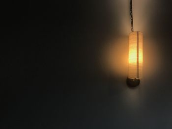 Illuminated light bulbs hanging from ceiling