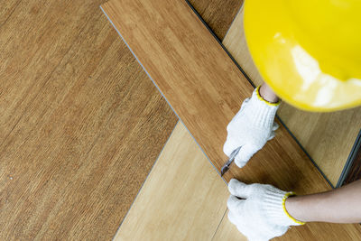 High angle view of man working on floor at home