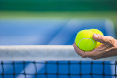 Close-up of hand holding ball